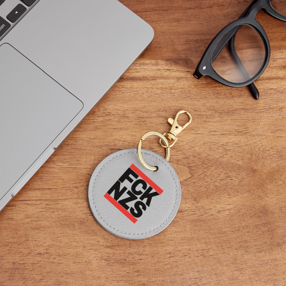 FCK NZS (schwarze Schrift) - BOUTIQUE Schlüsselanhänger - Grau